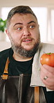 Talking, recording and face of chef in kitchen explaining tomato for meal tutorial, advice or recipe. Cooking, vegetable and portrait of man culinary artist with food tips for live streaming in house