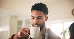 Coffee, relax and smile of man in home with cup for break, free time or wellness on weekend.  Comfort, cup and morning with happy person drinking fresh caffeine beverage in kitchen of apartment