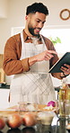 Happy man, chef or tablet with ingredients for recipe, cooking tutorial or online tips at home. Male person, research or technology with checklist or app for hospitality, catering or food preparation