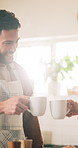 Morning, coffee and couple toast in home kitchen with conversation, cup and mug with drink. Smile, communication and love of people with cheers, house and marriage talking for breakfast plan with tea