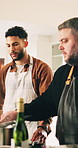 Cooking, chef and demonstration with man in kitchen of home for cuisine or meal preparation. Ingredients, learning and recipe with people at counter in culinary class for diet, health or nutrition