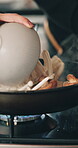 Woman, hands and cooking mushrooms in frying pan for breakfast, meal preparation or organic diet. Closeup, person or fresh vegetables for nutrition, culinary dish or healthy recipe for dinner in home