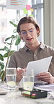 Man, documents and discussion with meeting at startup, review and planning for proposal at tech company. Person, paperwork and check stats with report, talking and insight for project in boardroom