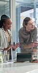 Business people, meeting and research with tablet in project discussion, review or collaboration at office. Group of employees, teamwork and planning on technology for schedule or brainstorming tasks