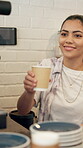 Happy, woman and barista with latte, coffee shop and purchase of hot beverage, takeaway and morning. Hospitality, customer and server with cup in small business, people and smile for sale in cafe
