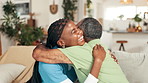 Happy, hugging and senior man with nurse on sofa for good news, help or healing with treatment. Support, thank you and caregiver embracing elderly patient for empathy in living room at nursing home.