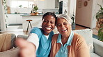 Face, laughing and selfie of nurse with old woman on sofa in living room of retirement home. Memories, photograph or social media with caregiver and senior patient in apartment for profile picture