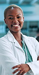 Smile, arms crossed and face of black woman scientist in laboratory for pharmaceutical, biotech or medical research. Healthcare, portrait and person with confidence, pride and knowledge in lab