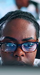 Programming, glasses and black woman developer with code, computer or web design. Desktop, face and website development with African employee in workplace for administration, reading and network