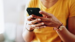 Hands, woman and typing with phone in home for online chat, social media post and checking news update. Closeup, person and smartphone for internet scroll, text message or email notification in house