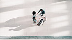 Above, handshake and business people in office, greeting and welcome with introduction. Group, gesture and employees in workplace, shaking hands and hello with collaboration, b2b deal or partnership
