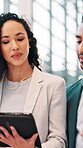 Business, people and walking with tablet for discussion of insurance application, risk assessment and planning. Underwriter, teamwork and digital report for policy negotiation and performance review