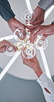 Hands, toast and business people for goals, success and social event in office party and low angle. Champagne glasses, alcohol and happy colleagues with team or cheers for work celebration together