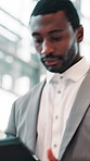 Happy, business and black man in office, tablet and internet with research for profit report. African person, employee or investor in workplace, tech or connection with online proposal for investment