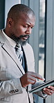 Corporate, black man and typing on tablet in office for reading email, financial report and management. Male person, digital and research with schedule update, budget planning and investment feedback
