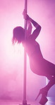 Spotlight, sexy and pole dancing with woman in night club for stripper, exotic performance and neon. Lingerie, seductive and go go dancer with person in studio for burlesque, entertainment and stage
