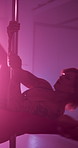 Woman, night and flexible dancer on pole for private performance, party or acrobatics in strip club. Artist, performer or sensual movement dancing in lingerie for entertainment, show or burlesque 