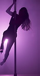 Stage, silhouette and pole dancer in spotlight for night performance, spin or sensual movement at VIP party. Neon, woman and private performer at nightclub with flexibility, burlesque dance or talent