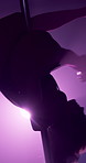 Woman, pole dance and flexible at nightclub, performance and creative with neon, art and burlesque concert. Person, exotic dancer and spin for private show, stretching and fantasy on stage with smoke