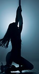 Sexy, silhouette and floor with dancer at club for exotic performance, burlesque and entertainment. Sensual, pole dancing and neon with female person in studio for movement, stripper tease and stage