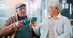 Cheers, coffee and retirement with senior couple on sofa in living room of home together. Bonding, happy or toast with old man and woman in apartment drinking caffeine beverage for relax or romance