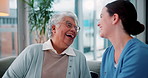 Conversation, happy and nurse with senior woman on sofa in nursing home for consultation. Consultation, good news and caregiver with elderly female patient for medical checkup in living room at house