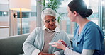 Senior woman, nurse and pills on couch for discussion, guide and listening for medicine schedule in lounge. Elderly person, caregiver and pharmaceutical drugs with talking on sofa in retirement home
