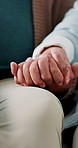 Holding hands, sofa and closeup of senior couple for love, support and bonding at home. Retirement, marriage and mature people together on couch for trust, commitment and affection in living room