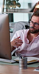 Businessman, consultant and writing with headset on computer for online advice or desktop support at office. Man, agent or talking with technology or notes for customer service or call center enquiry