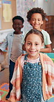 Face, kids and students in classroom, dance and learning with fun, education and growth. Portrait, group and child development in school, energy and excited with movement, mobility and creativity