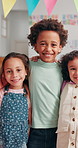 Education, smile and hug with face of friends in classroom for child development, learning and growth. Academy, knowledge and future with group of students at school for studying, lesson and kids