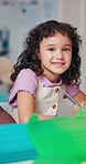 Writing, portrait and child with exam, classroom and knowledge for project, growth or development. Elementary, studying and kid with notebook for test, learning or girl with information for education