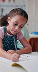 Writing, learning and child with exam, classroom and knowledge for project, growth and development. Elementary, studying and kid with notebook for test, student or girl with information for education
