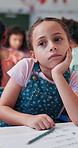 Bored student, thinking and child in classroom for education, problem solving or study with idea. Tired, girl and kid at school with thoughts for learning, knowledge and daydreaming with reflection