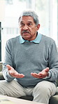 Therapy, senior man and talking in clinic, consultation and elderly patient with session for mental health. Healthcare, conversation and counselling of old person in office, retirement and stress