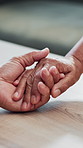 Holding hands, old couple and home with love, kindness and compassion with relationship. Closeup, people and man with woman, gratitude and hope with romance, retirement and marriage with comfort