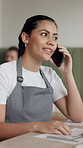 Woman, waitress and talk with phone call at cafe for discussion, online orders and inventory management. Female person, mobile and conversation for stock chat, client reservation and customer service