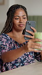 Phone, photograph and smoothie with black woman in coffee shop for social media picture or post. Beverage, detox and drink with happy customer in cafe or restaurant for photography as influencer