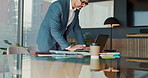 Research, entrepreneur and man with laptop, office and planning for investment on website and corporate. Business, trading and mature person with tech for stock market, information and working