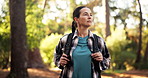 Hiking, woman and walk in forest for fitness adventure, weekend hobby and cardio wellness. Nature person, journey and relax with backpack for trekking, explore and holiday sightseeing in woods
