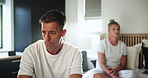 Bedroom, couple and man with ignore after fight, misunderstanding and sad in toxic marriage. Home, woman and angry partner with silent treatment in relationship, cheating and divorce for infidelity