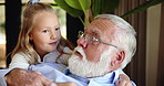 Love, hugging and grandfather with kid in home with bonding, happiness and family time. Smile, conversation and senior man embracing with girl child for care together in living room in house.