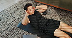 Home, crunches and man with fitness, above and training routine with endurance, wellness and energy. Apartment, healthy person or athlete in lounge, exercise and workout with core strength or warm up
