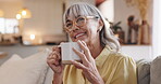 Senior, woman and tea with thinking on sofa for happy memory, daydreaming and peaceful in retirement. Elderly person, smile and beverage in home with reflection, nostalgia and relax in living room