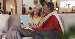 Home, old couple or laughing with tablet movie, video or smile for funny joke in lounge. Comedy humor, relax or happy people on technology together on couch in house living room for streaming film