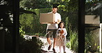 Walking, new home and child with father for real estate, property relocation and stuffed animal. Kid, happy girl and dad moving with mortgage, loan and carrying box for arrival in backyard outdoor