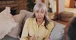 Senior couple, discussion and sofa with argument for disagreement, conflict or fight at home. Elderly woman, man or talking with confession or accusation for marriage or living room dispute at house