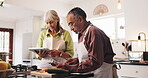 Cooking, discussion and tablet with old couple in kitchen for food blog recipe, nutrition tracking and health app. Meal prep, dinner planning and retirement with senior man and woman at home for love