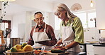 Cooking, help and tablet with old couple in kitchen for food blog recipe, nutrition tracking and health app. Meal prep, dinner planning and retirement with senior man and woman at home for love