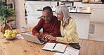 Finance, senior couple and typing on laptop in home for account management, retirement fund and budgeting. Above, interracial people and financial review for pension savings and mortgage investment